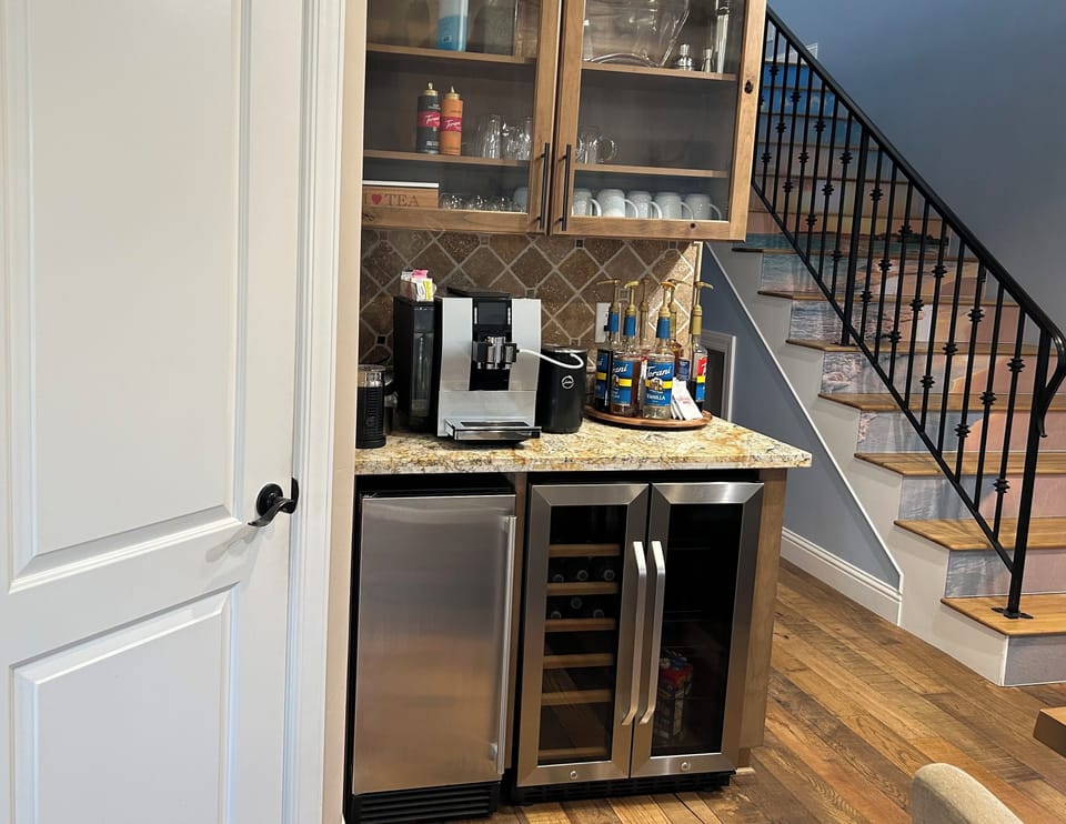 Coffee bar, beverage fridg, ice maker. Espresso cups, coffee mugs for 14