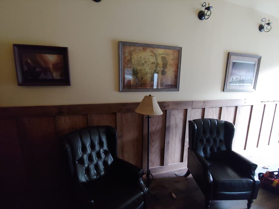Entry Foyer with seating, 50" TV and game cupboard 