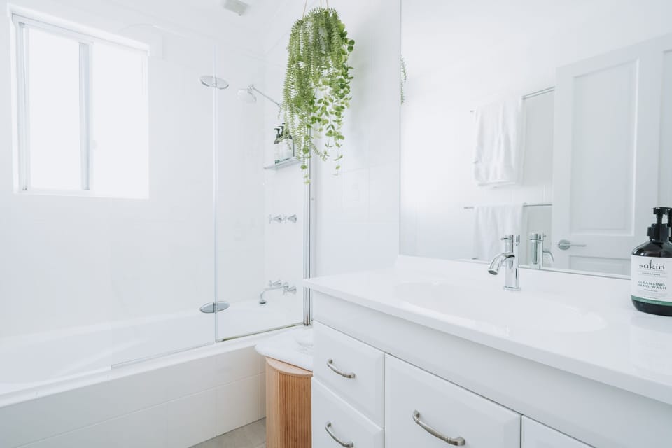 Upstairs bathroom with bath and shower