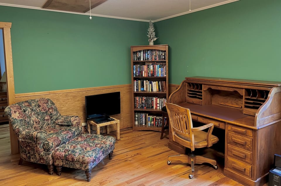 Cozy up and read a book or work from the desk. This is located in queen bedroom 
