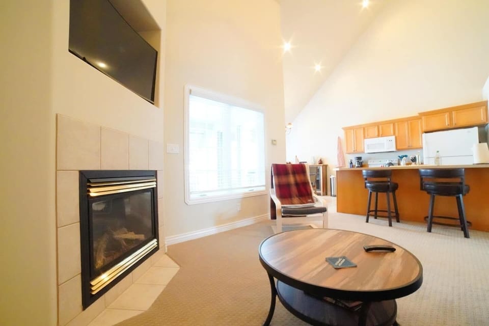 Whether you are sitting down to relax in the living room, hanging out in the kitchen, or having a snack at the dining room table, you can always be a part of the fun in this house.