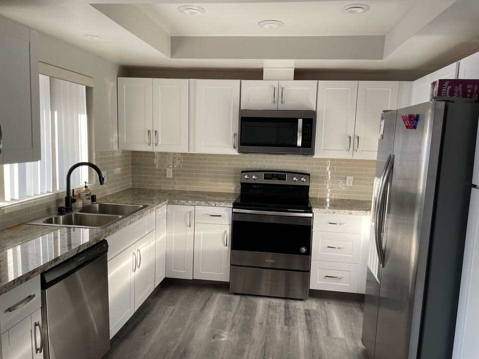 Kitchen - oven, fridge, dishwasher, microwave, pots, pans, dishes, and more!