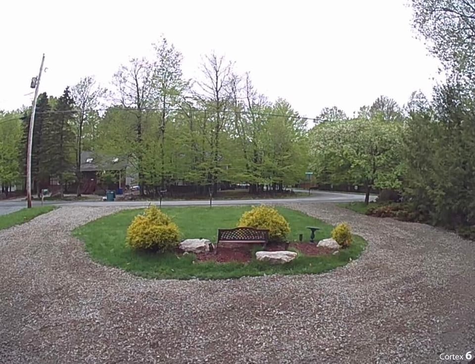 Front of the house with 5 paking spots in the driveway