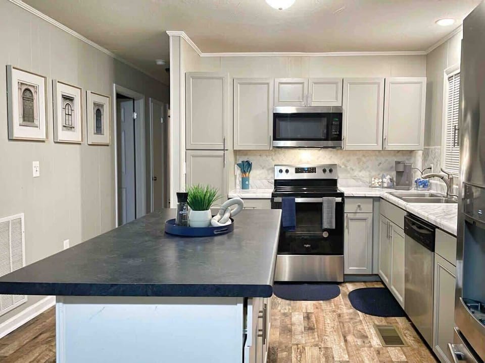 Fully equipped kitchen with stainless steel appliances and ample counter space
