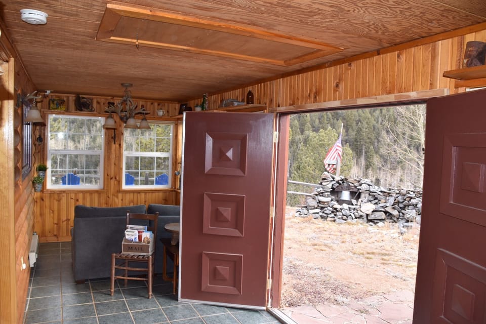 Sun room doors to fenced backyard.