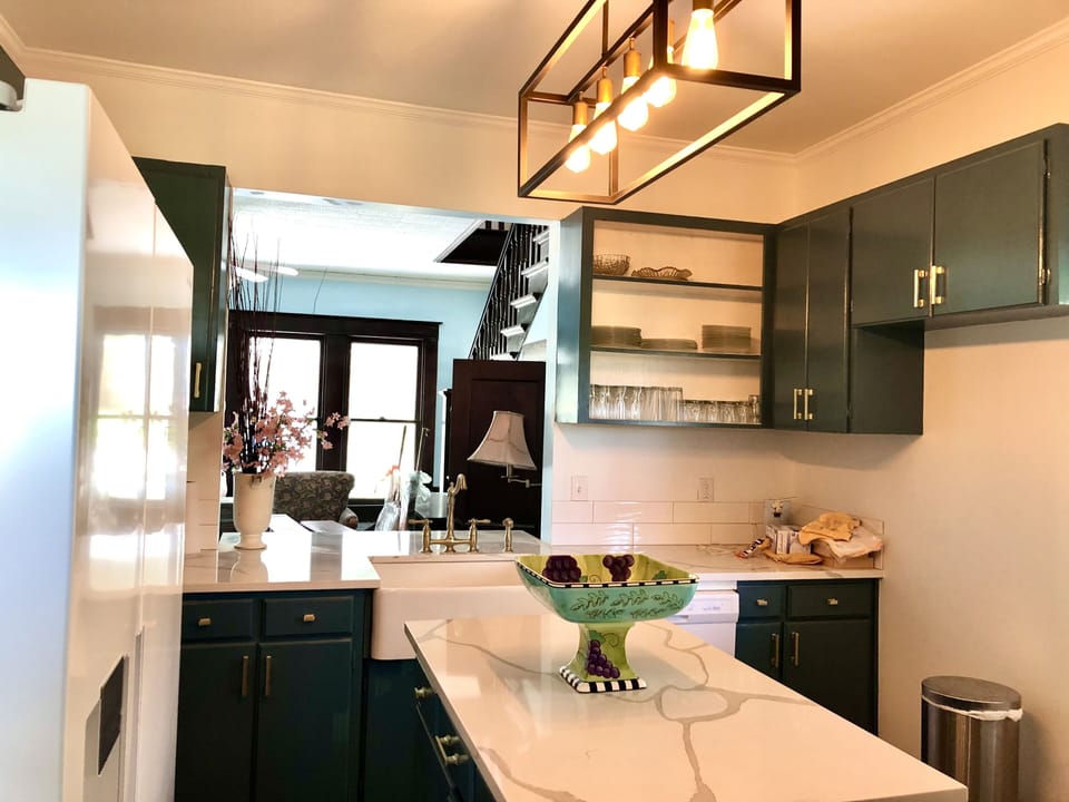 Kitchen with 2 seat breakfast bar looking into living room