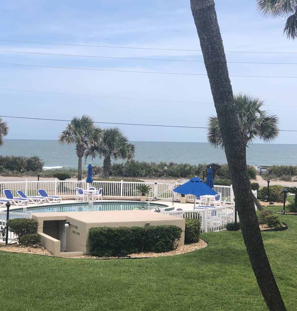 Balcony view of the waves over our sparkling pool 