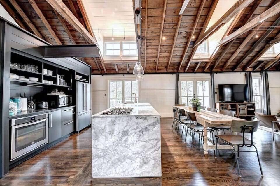 Elevate your culinary experience with a luxurious marble kitchen island, blending elegance and functionality seamlessly.