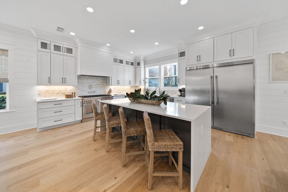Gourmet kitchen with high end appliances and island seating for 4
