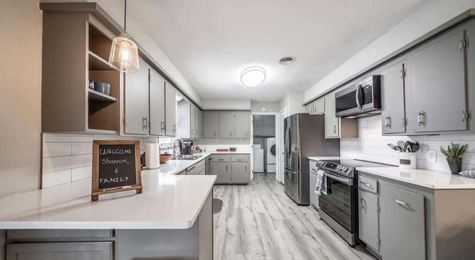 kitchen with new quartz counters and appliances