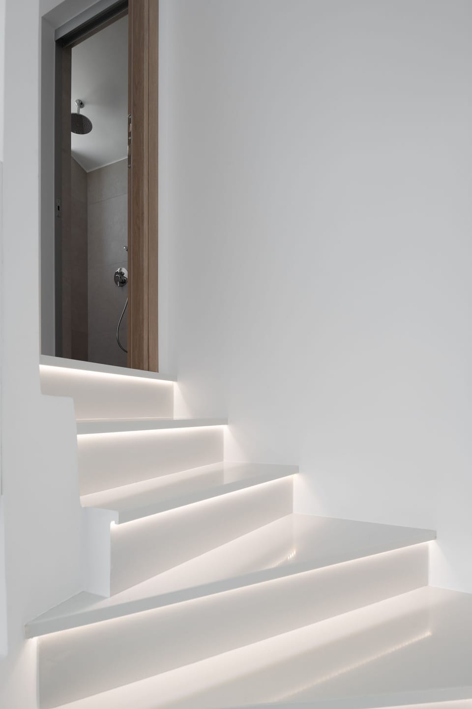 The stairs lead to the first floor sea view master bedroom 