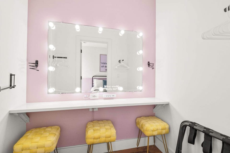Open up the closet and find your own private dressing room... Complete with a well lit makeup mirror for 2-3, hair dryer/straighter/curling iron, and stools. Don't get caught dead leaving this house without glamour!!

