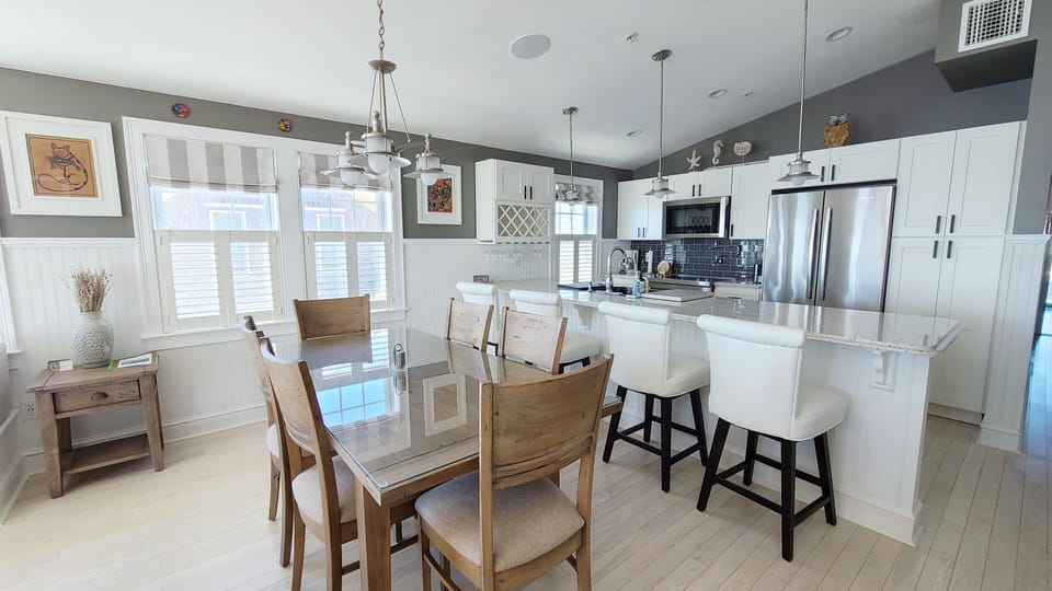 Dining area with kitchen beyond