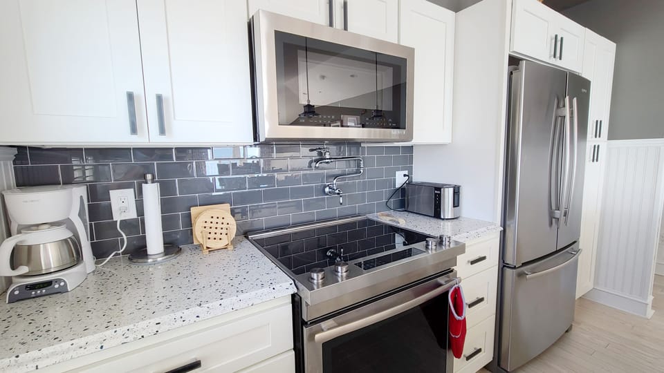 Nicely equipped kitchen with granite counter tops