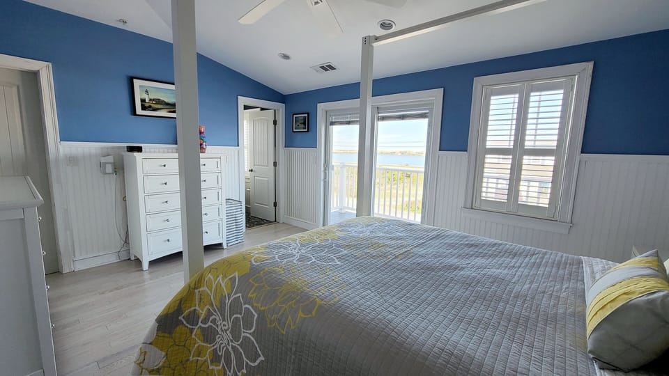 Primary bedroom with queen bed and ensuite bathroom