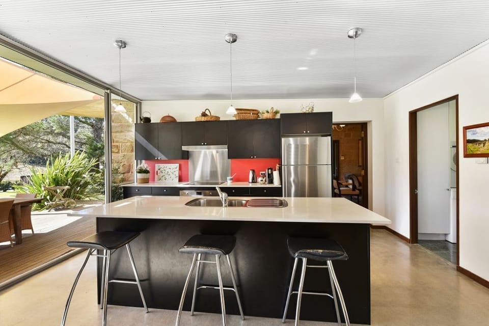 The kitchen and breakfast bar have everything you need