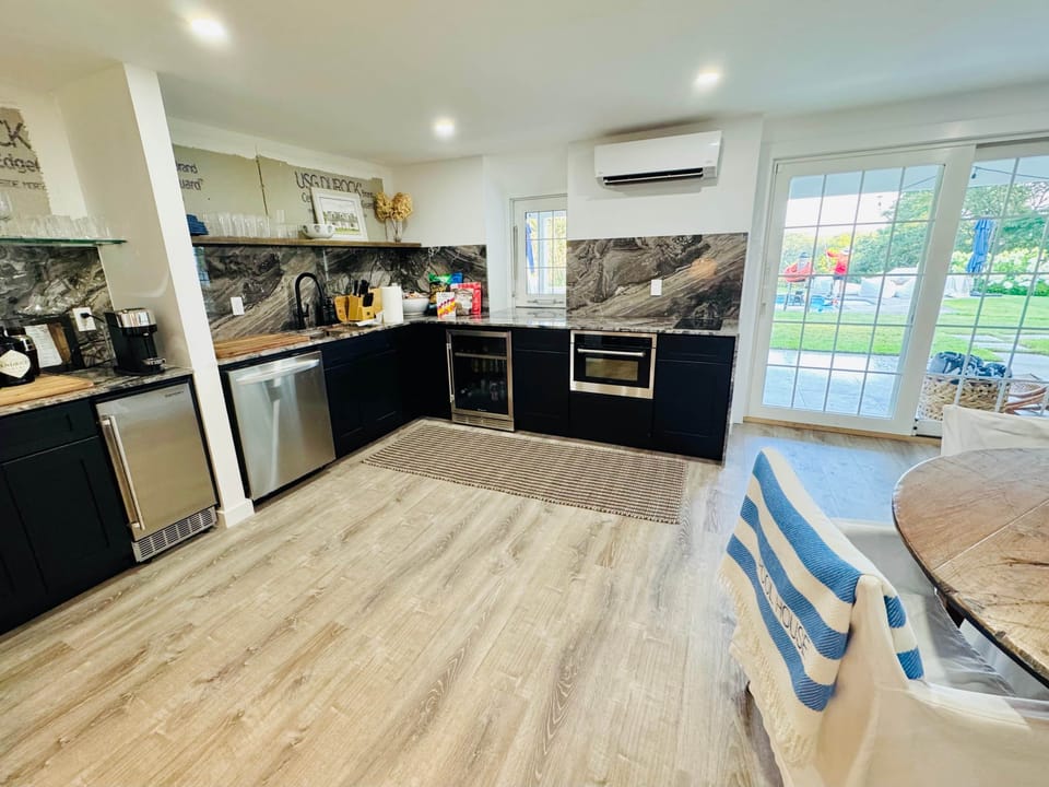 The 2nd kitchen is pool-level dishwasher, speed-oven, drink fridge, ice-maker & pass-thru window.