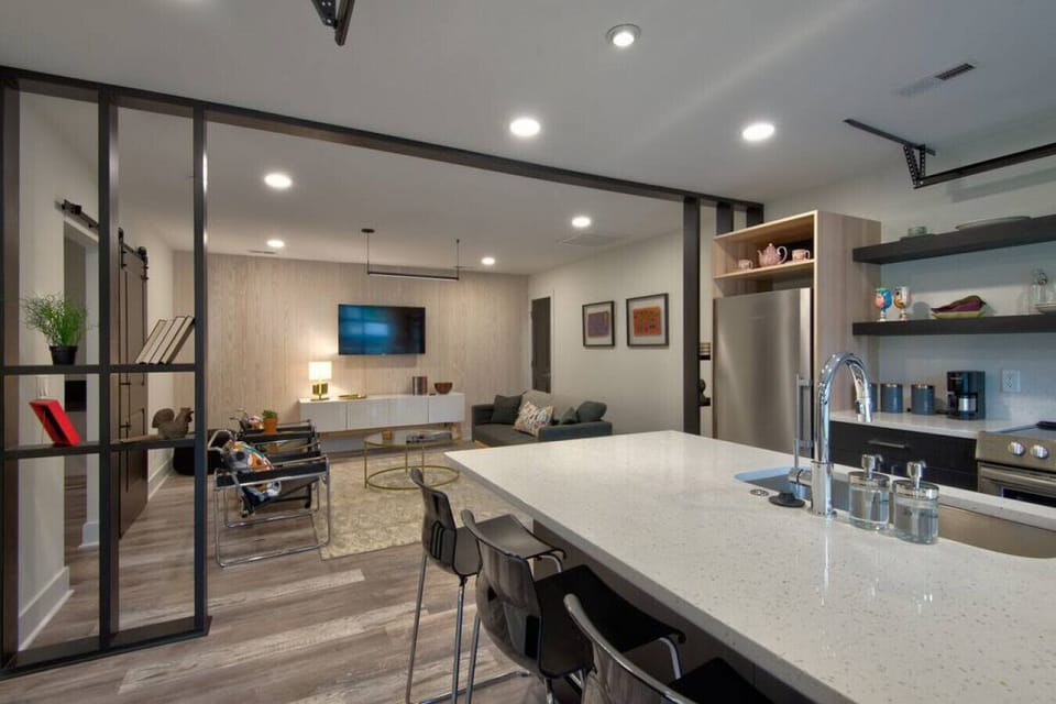 Open-Concept Living – Bright, airy space with designer furniture, curated artwork, and plenty of natural light