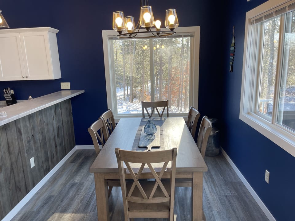 Dinning area with amazing views of the lake and woods