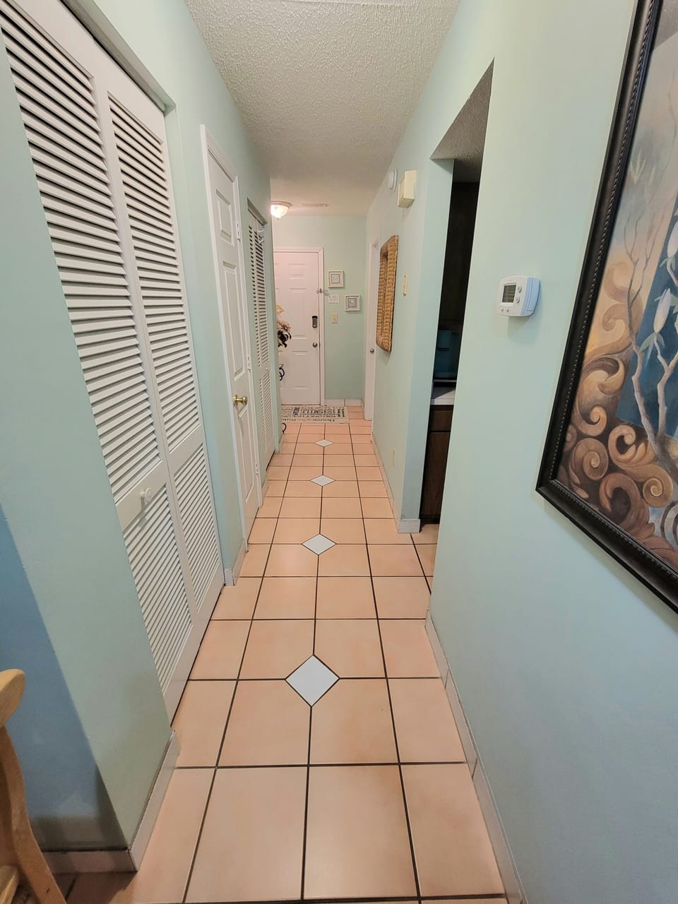 Hallway toward kitchen and bathroom 