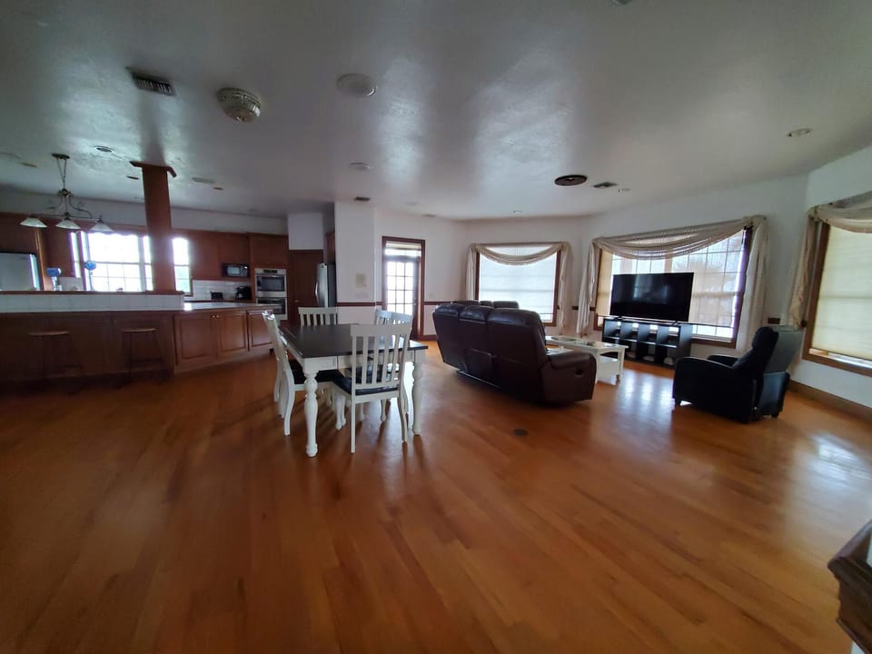 Main Dining table and large comfy reclining sofas.