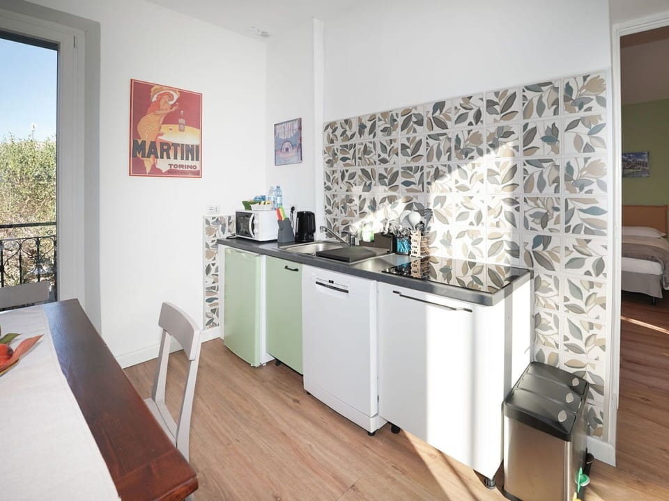 Furniture, Interior Design, Wood, Flooring, Floor, Room, Lighting, Major Appliance, Kitchen, Kitchen Appliance