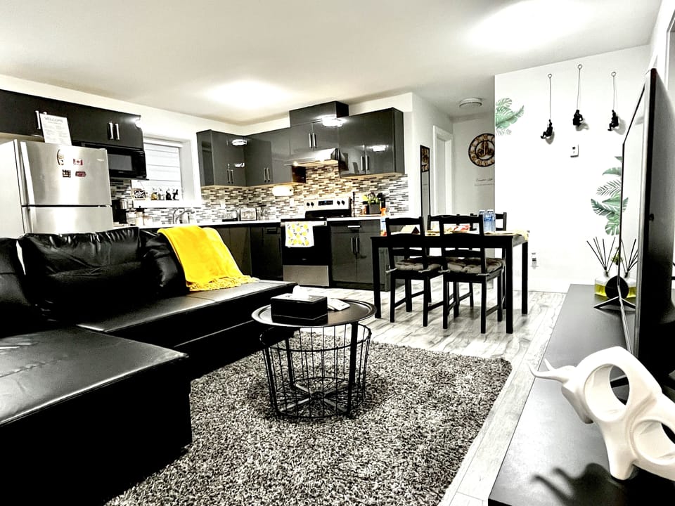 Living room with comfortable leather sofa bed, LG TV with over 2000 channels. 