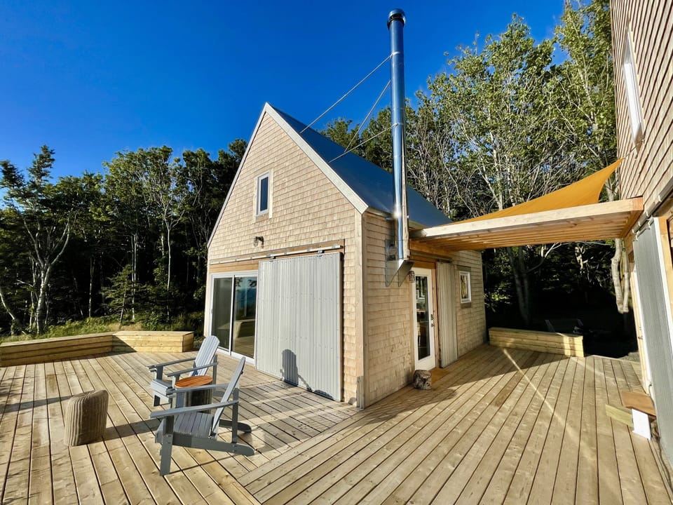 Two cabins (one living rm./kitchen, other bedrm. /bathroom ) surrounded by decks