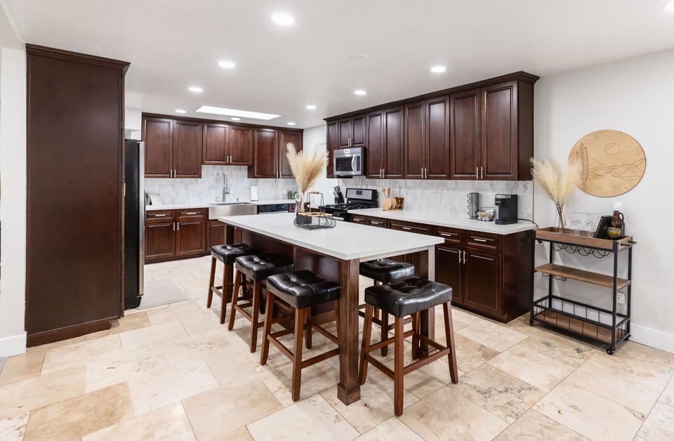 Full chefs kitchen with all of the utensils, pots, pans, coffee makers, etc
