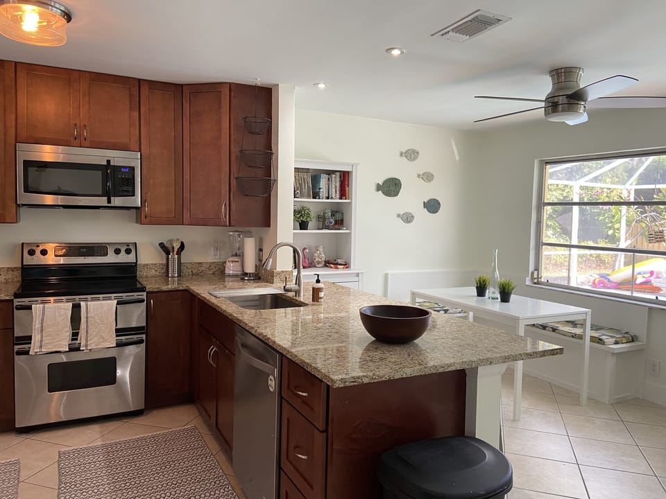 Open kitchen concept w/ built in dining seating