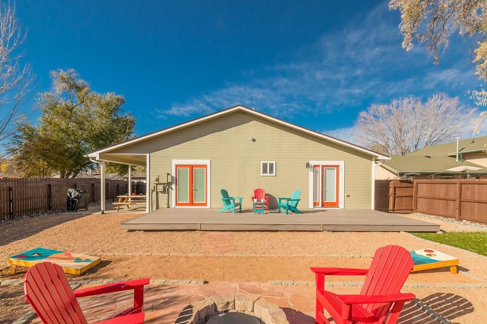 Enjoy the outdoors in this spacious backyard, perfect for family gatherings or relaxing in the sun.