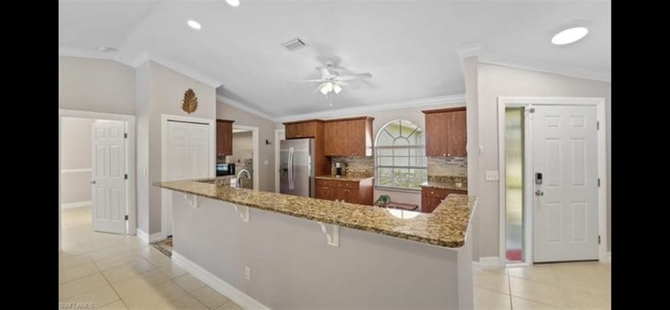 Open kitchen with bar stools