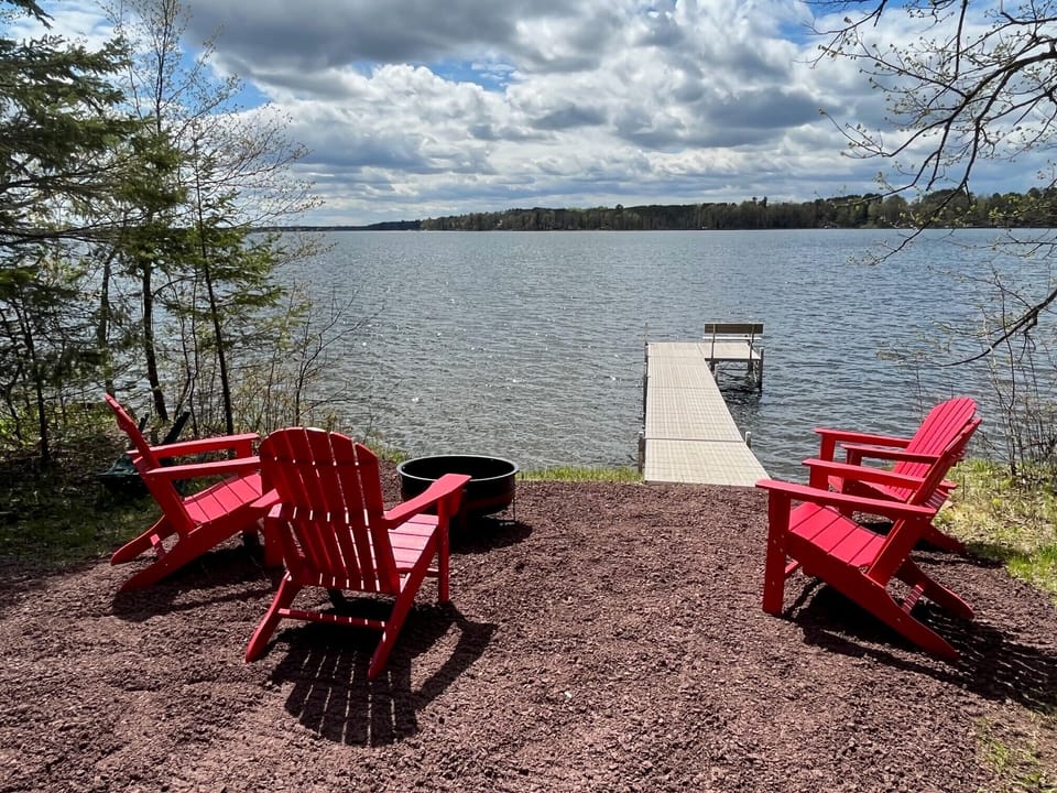 Private dock and shoreline with fire pit