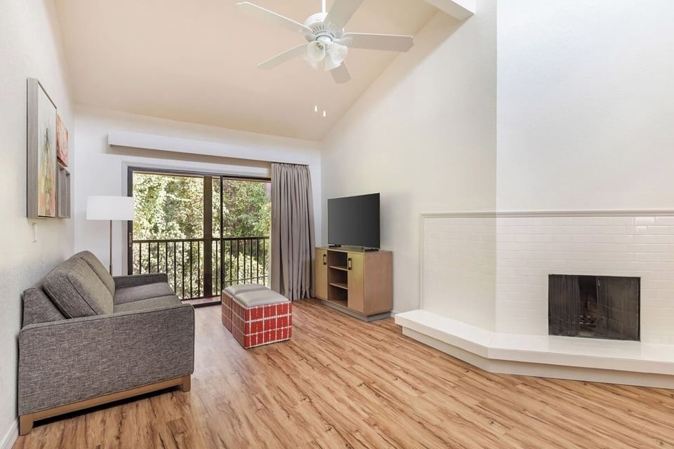 Lounge by the fireplace, then step out to the balcony.