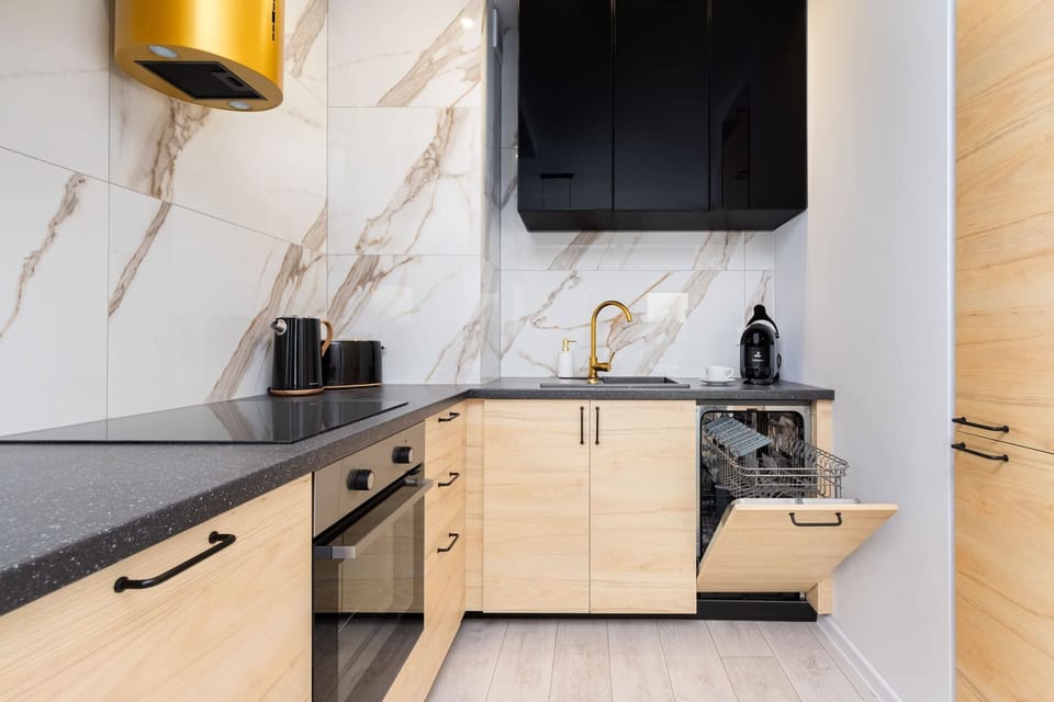 Kitchenette with oven and refrigerator. 