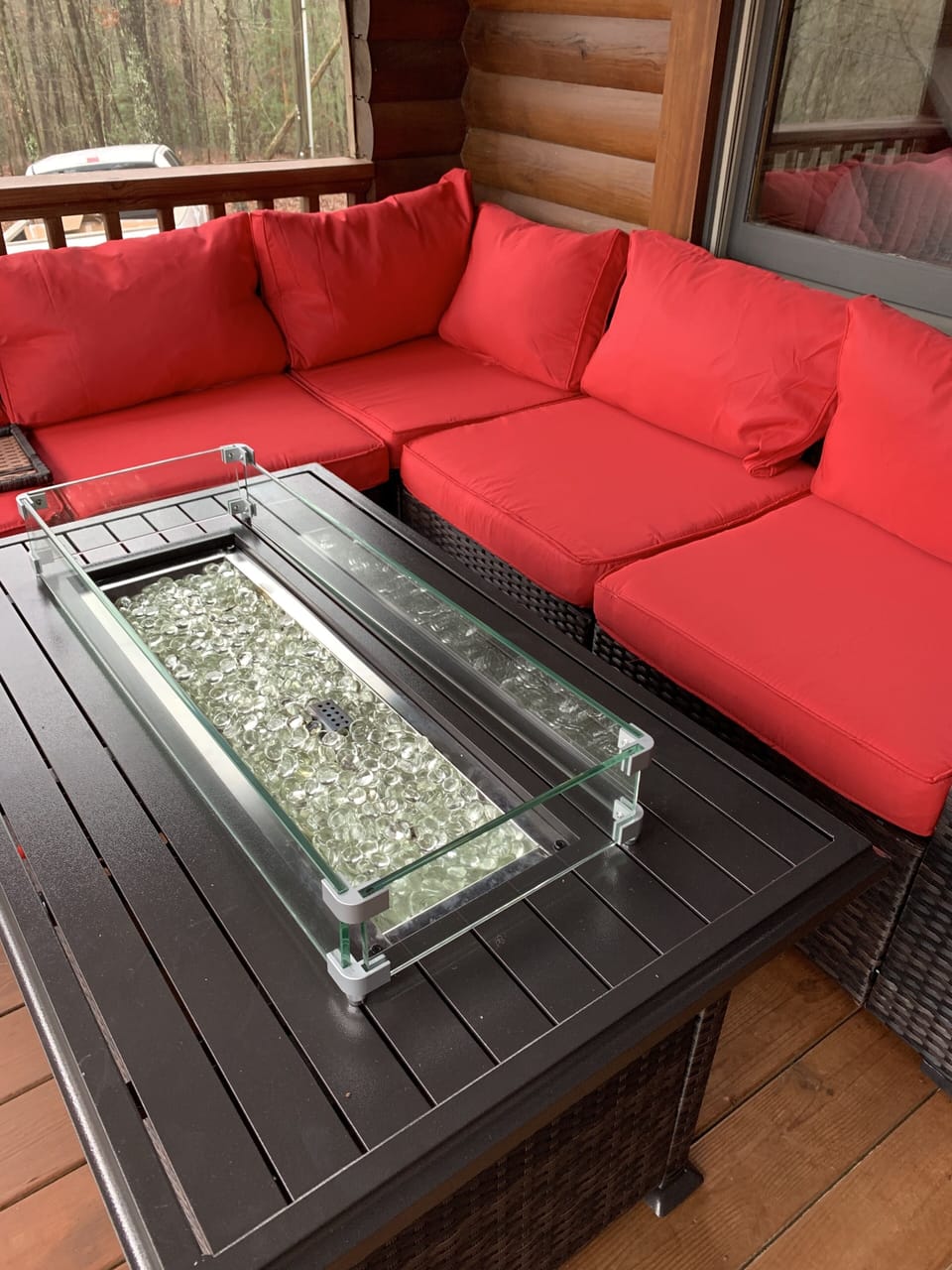 gas firepit and seating area on front porch