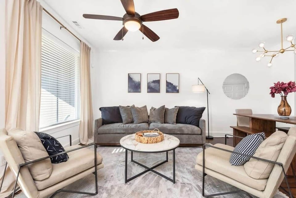 The living room offers a deep cushioned couch and relax two chairs to lounge, relaxing night, or social hour with your friends and family on your trip.