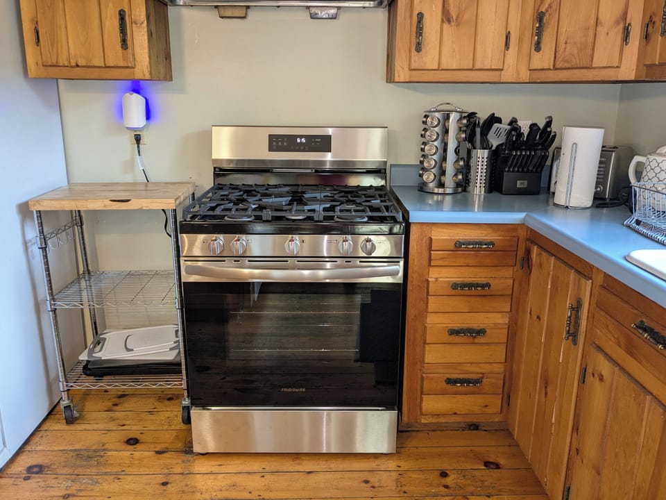 Our kitchen has a 5-burner gas range, 2 refrigerators, and 2 dishwashers.