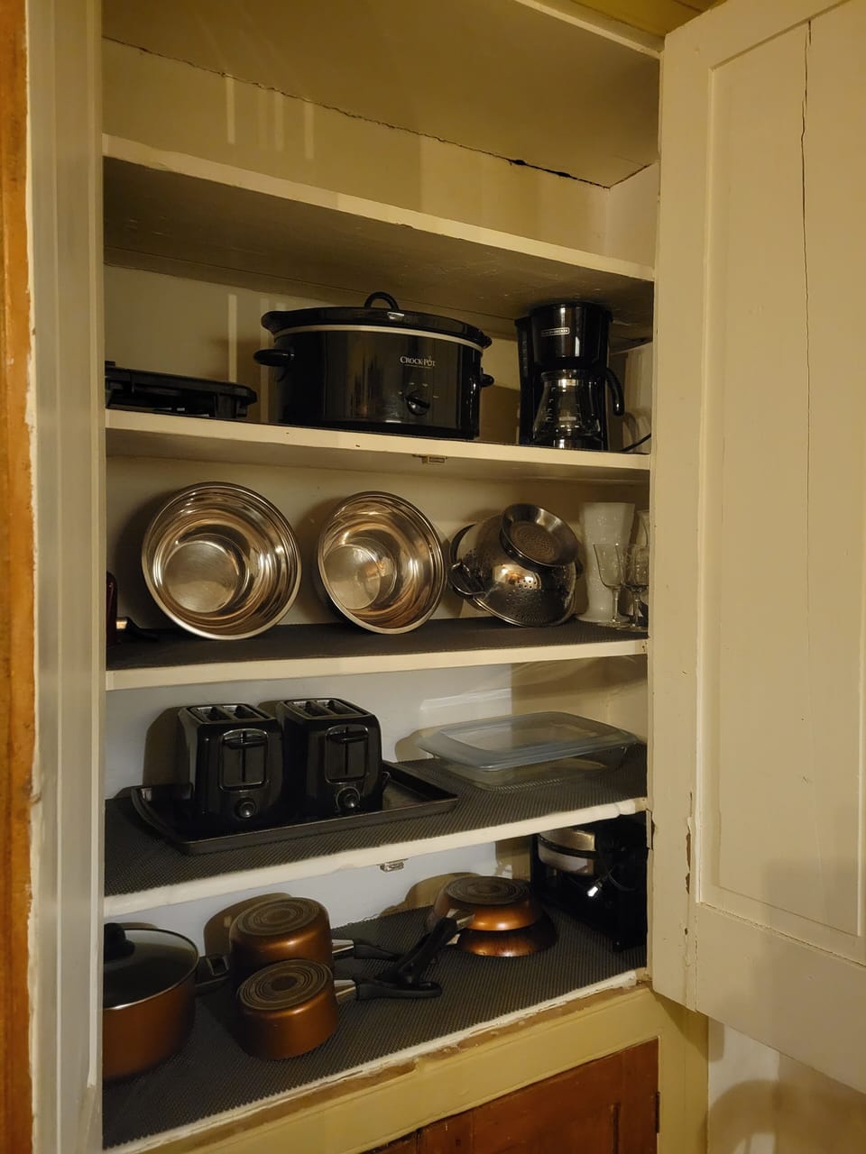 crock pot, coffee pot, griddle, waffle iron, colander, toasters, glass bakeware 