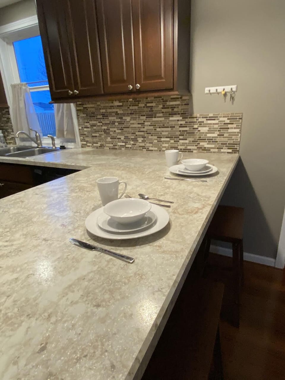 Breakfast bar in the kitchen has 2 stools.