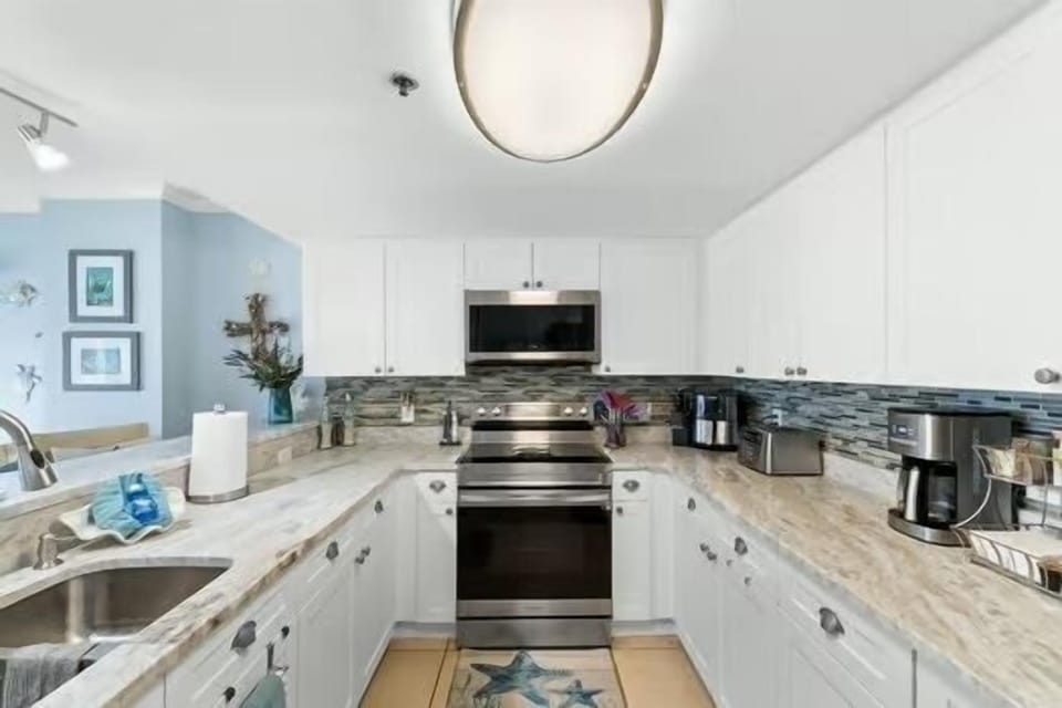 Kitchen with new countertops added in 2025.