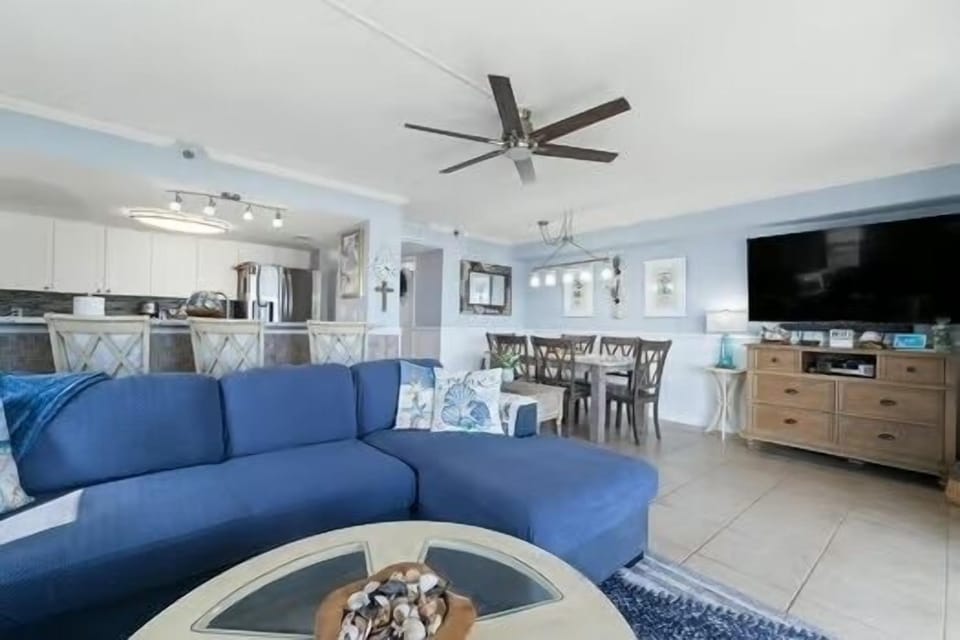 Living room, dining room that seats 6, 65” TV.