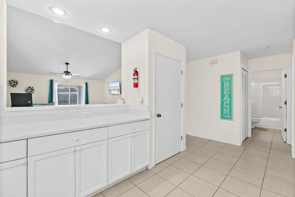 Fully equipped kitchen with flat stove top, refrigerator and freezer, dishwasher, coffee maker and more. (food and coffee not provided)