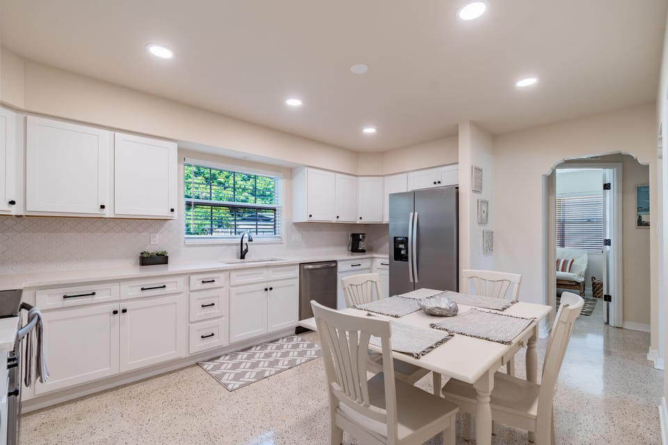 Spacious remodeled spacious kitchen fully stocked with pots and pans and dishes 