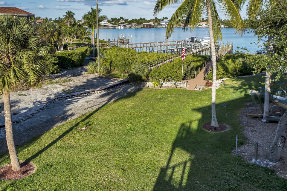 Second floor porch backyard and Pompano Bay View