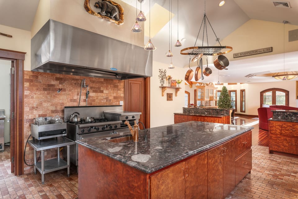 Chef's kitchen with 6 burner gas stove with griddle