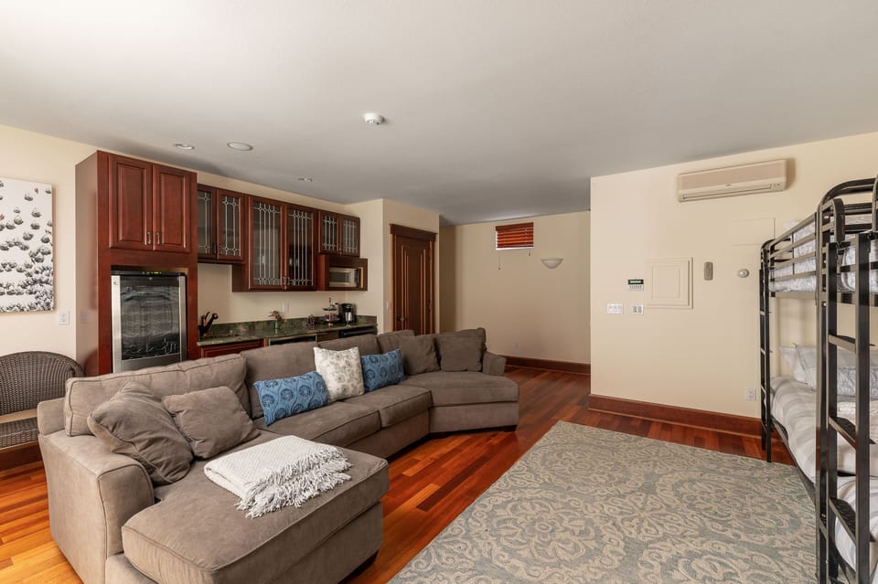 The room also has a kitchenette with wine fridge and direct access to hot tub