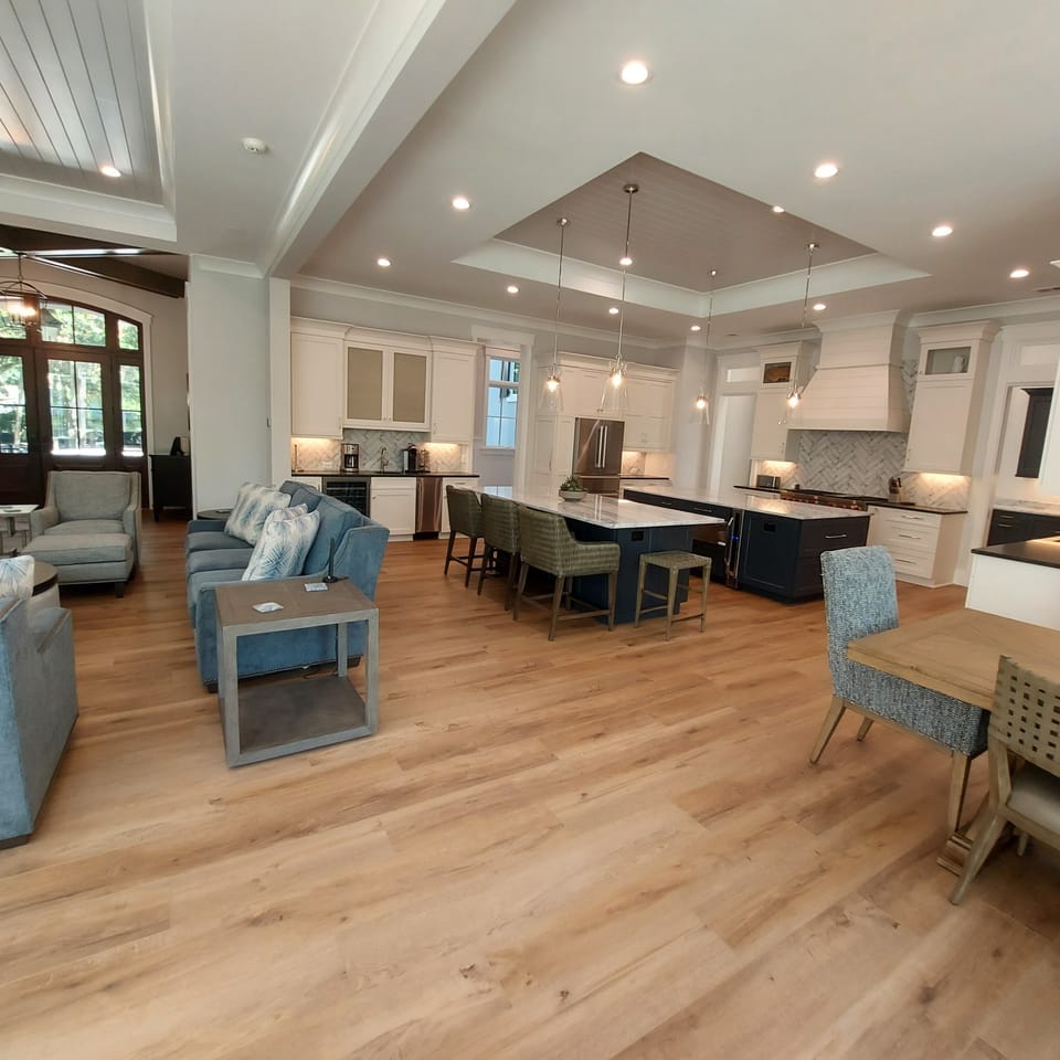 The entire great room, kitchen, and dining area are open to each other