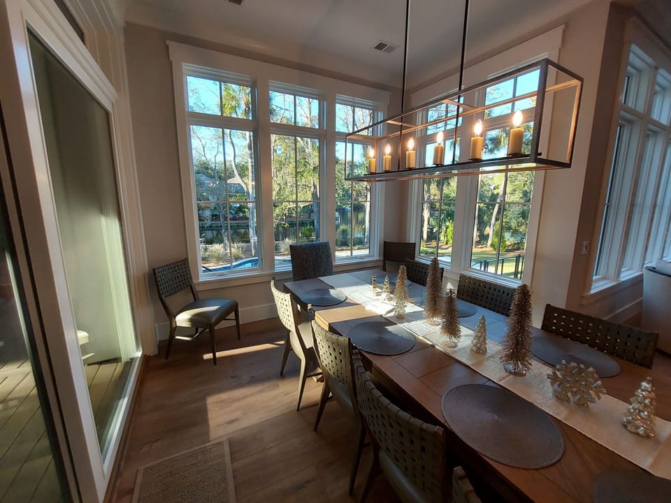 The sliding door off the dining area allows convenient access to the screen room