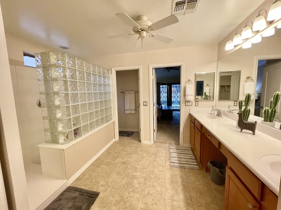 Master bath with large walk-in shower and closet.